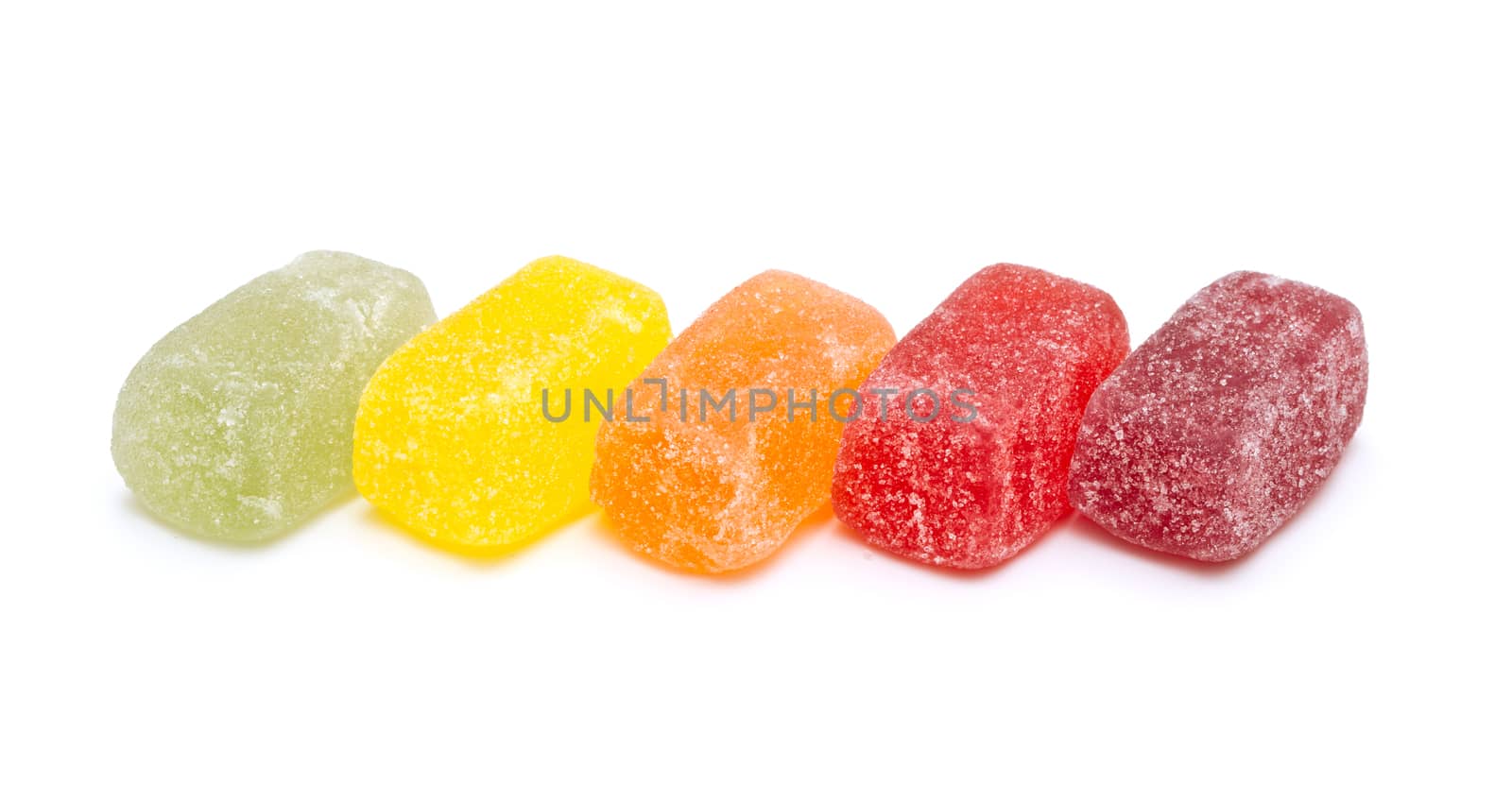 Different fruit jellies on white background