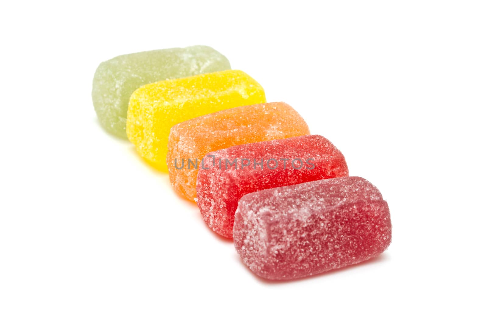 Different fruit jellies on white background