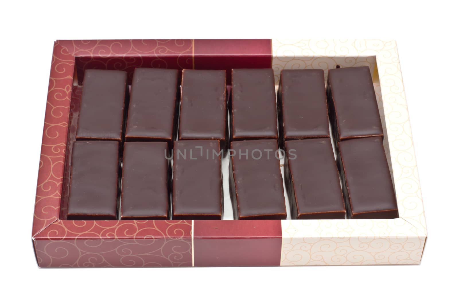 Chocolate pralines in box isolated on white background
