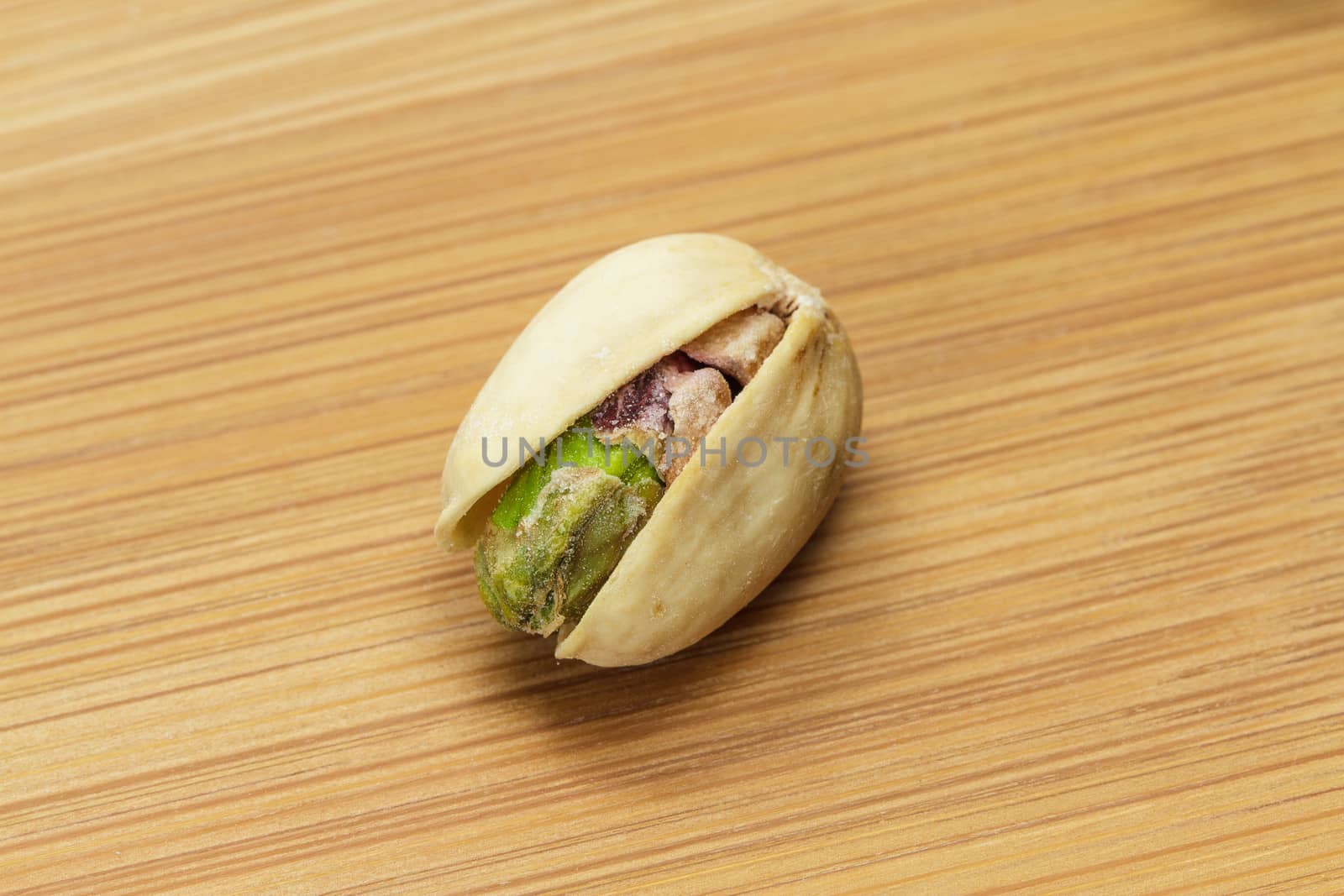 Pistachio nut on wooden board