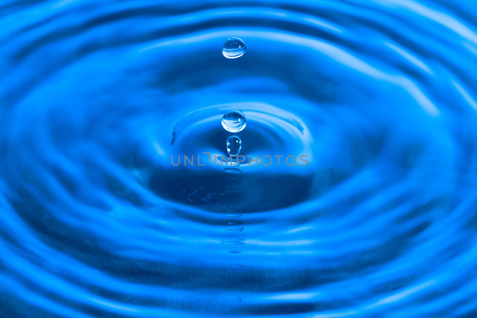 Water drop on liquid surface