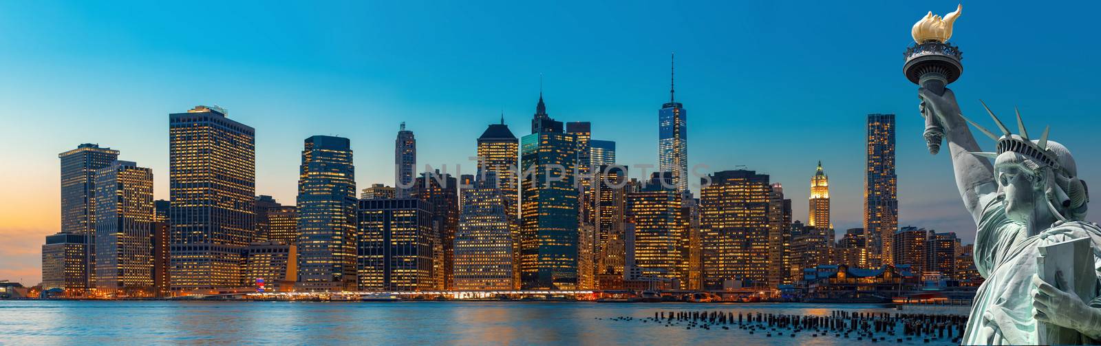 Evening New York City skyline panorama and The Statue of Liberty