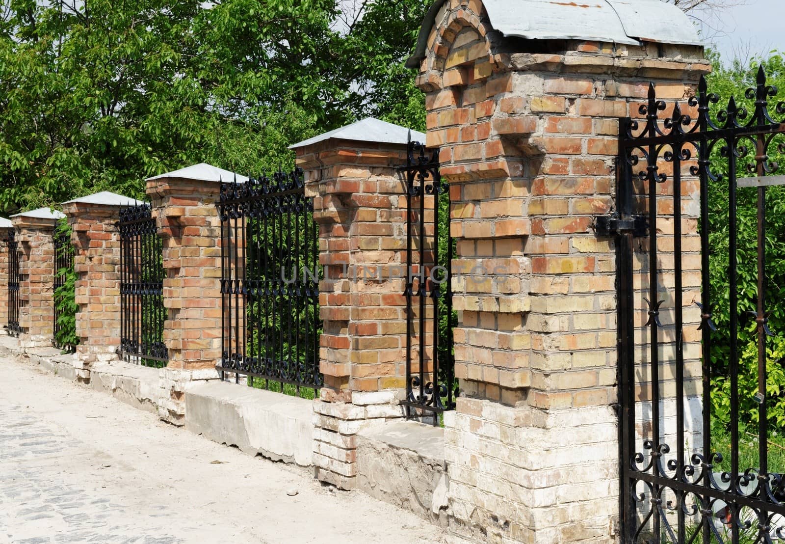 Brick and metal fence in Kiev Pechersk Lavra Monastery in Kiev, Ukraine