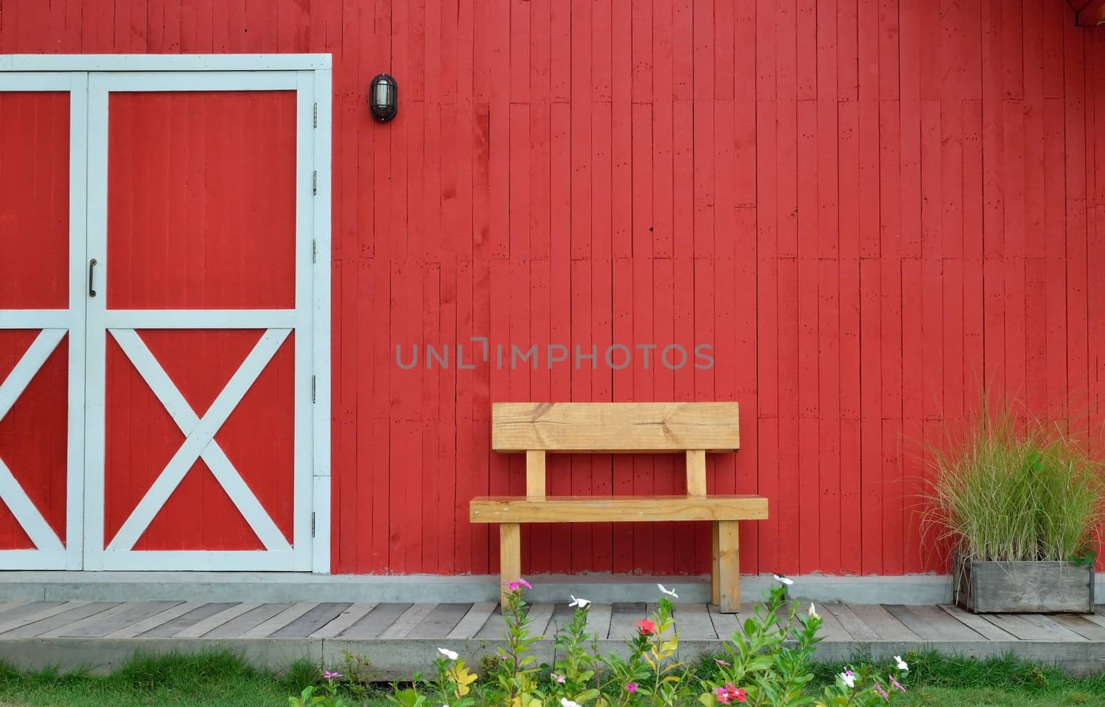 wood bench and red wall