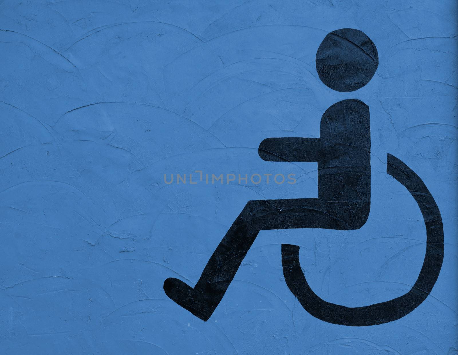 the symbol handicapped on blue wall background