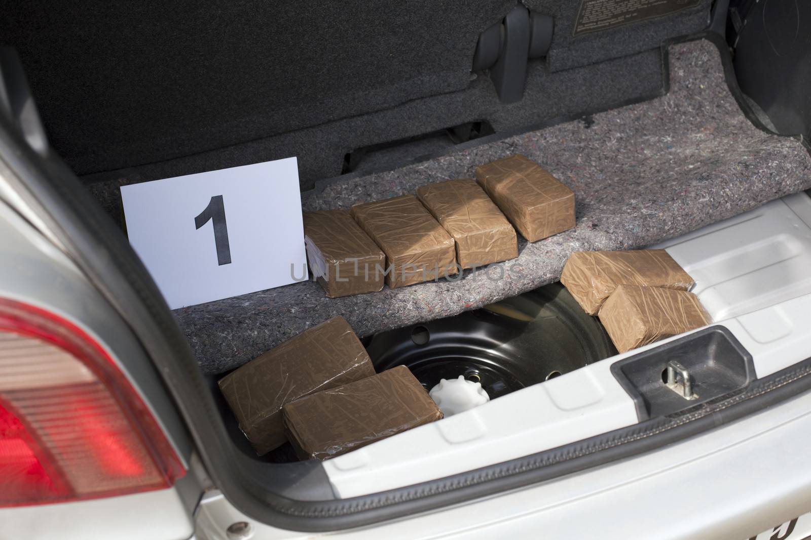 Cocaine packages in the trunk of a car