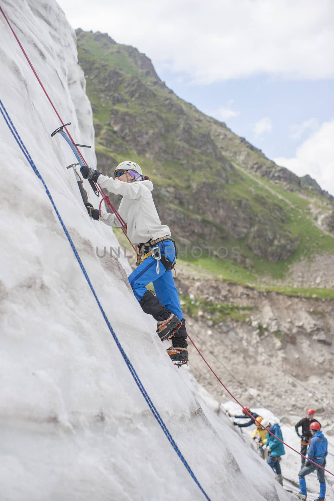 Girl climb up on the ice by kozak