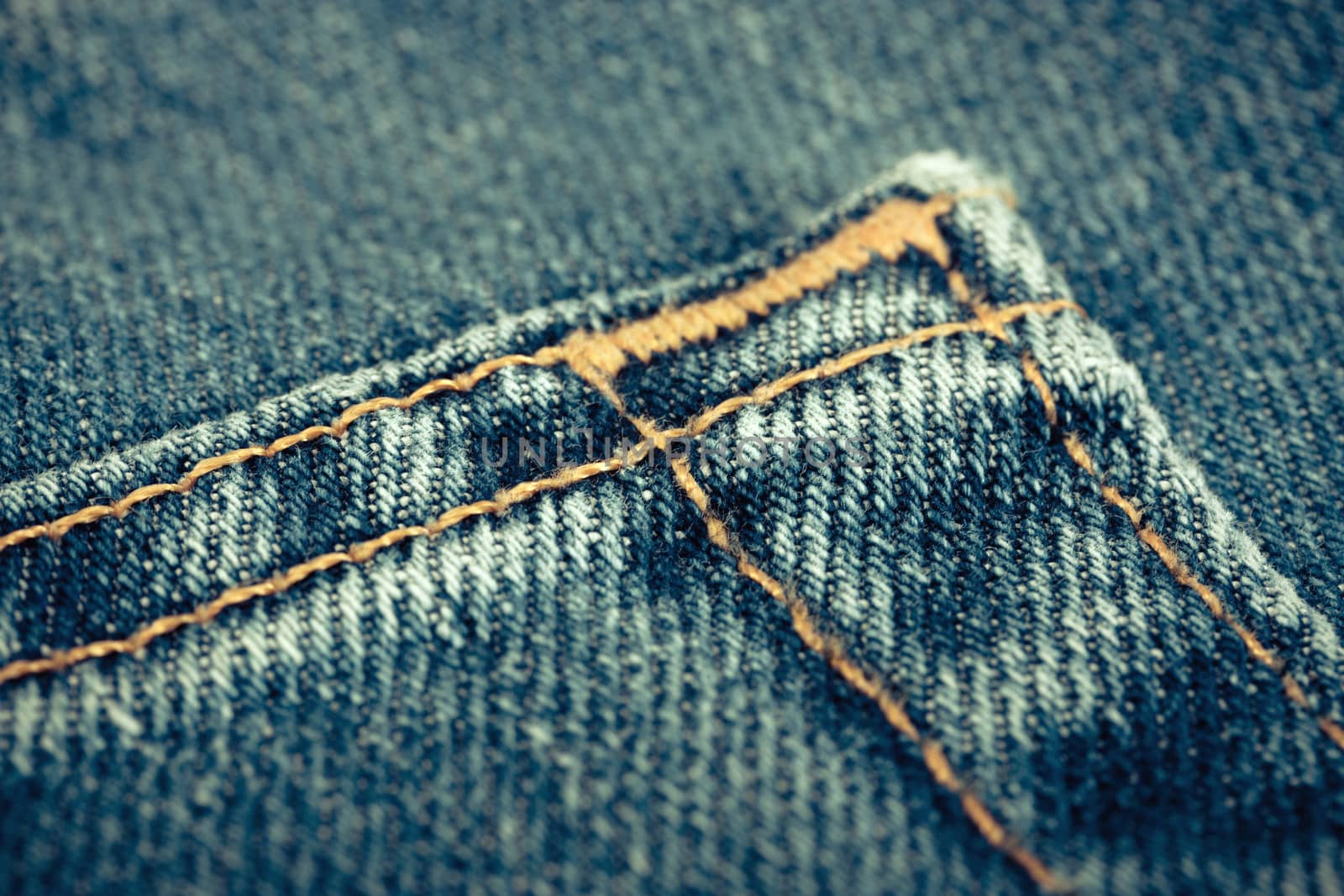 Blue denim jeans texture with thread