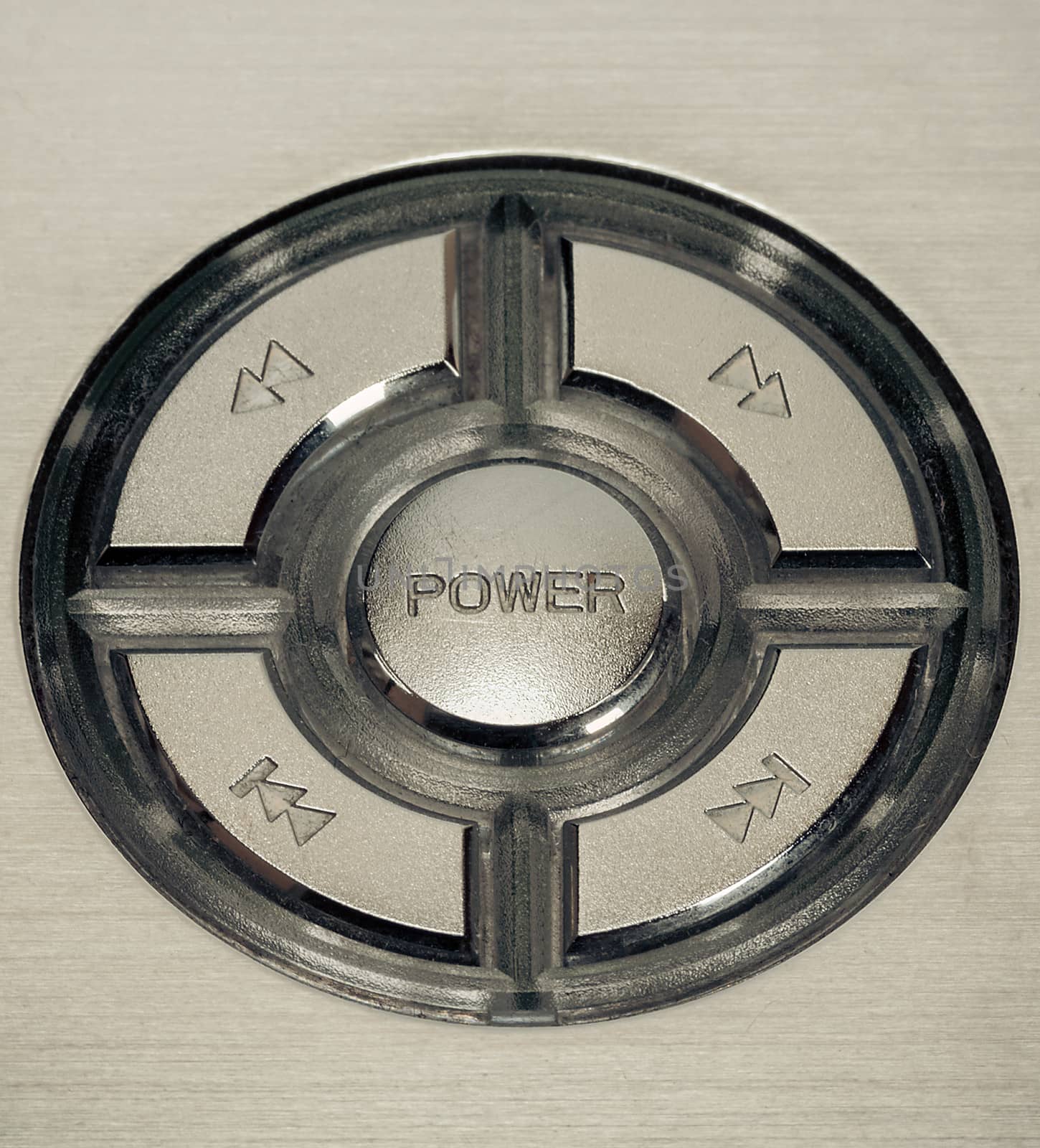 silver metal power button macro closeup
