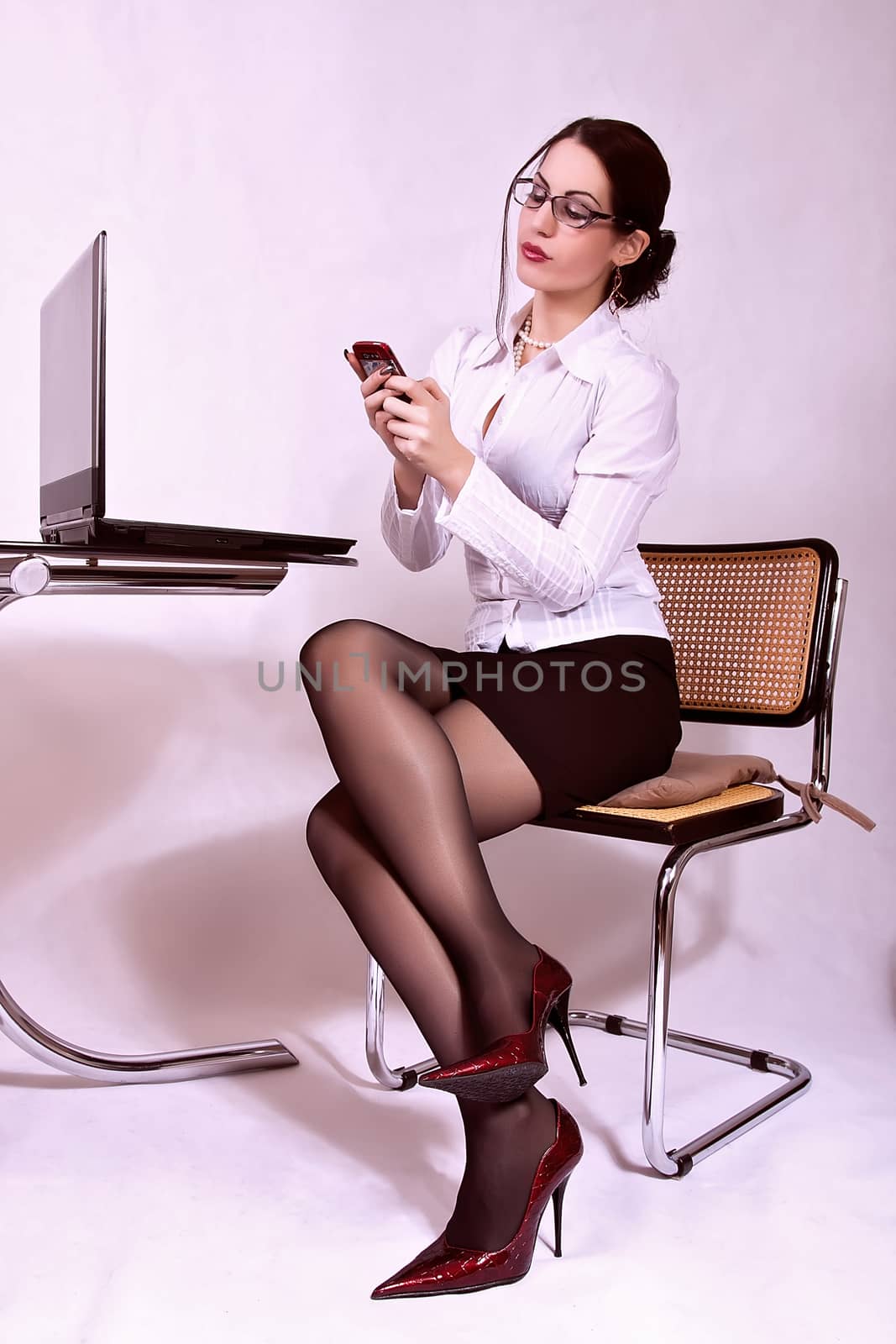 Attractive secretary sitting at desk by dukibu