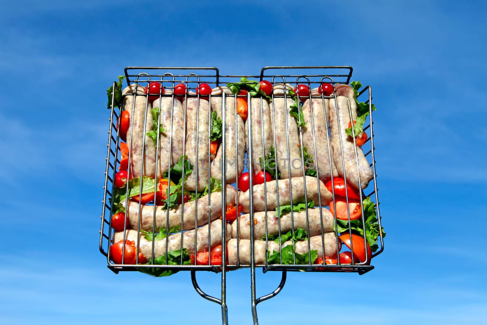 Sausage grill on the blue sky background