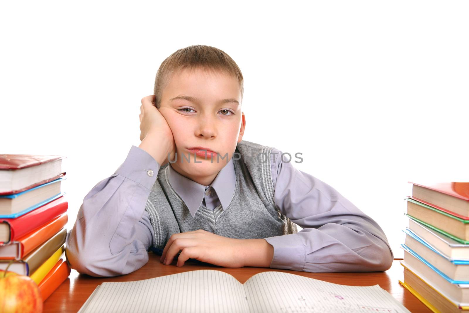 Bored Boy on the School Desk Isolated on the white background
