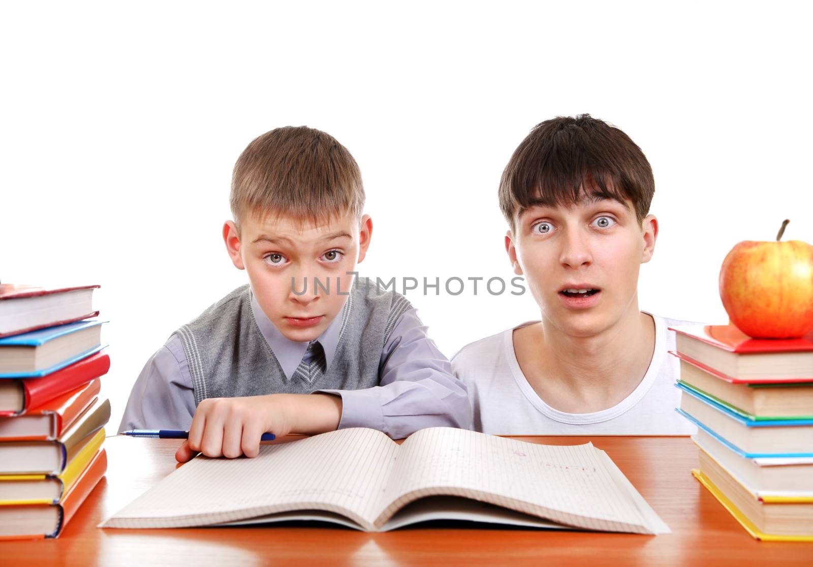 Surprised Older and Young Students at the School Desk Isolated on the White Background