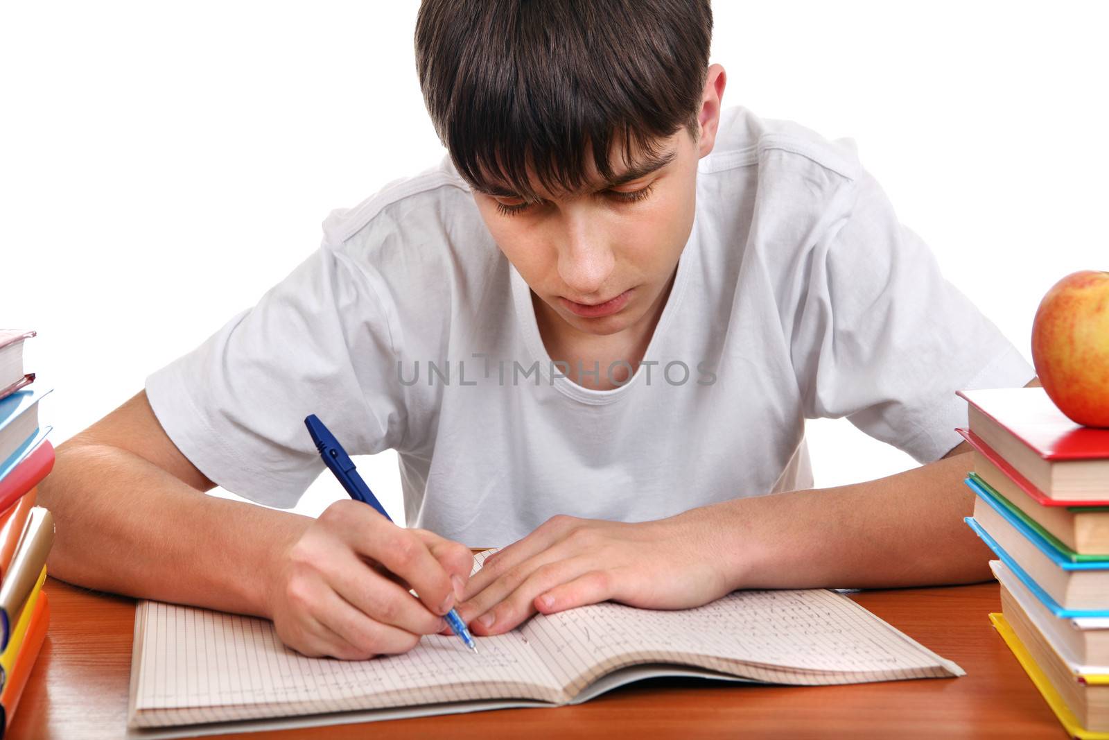 Student writing at the School Desk Isolated on the White Background