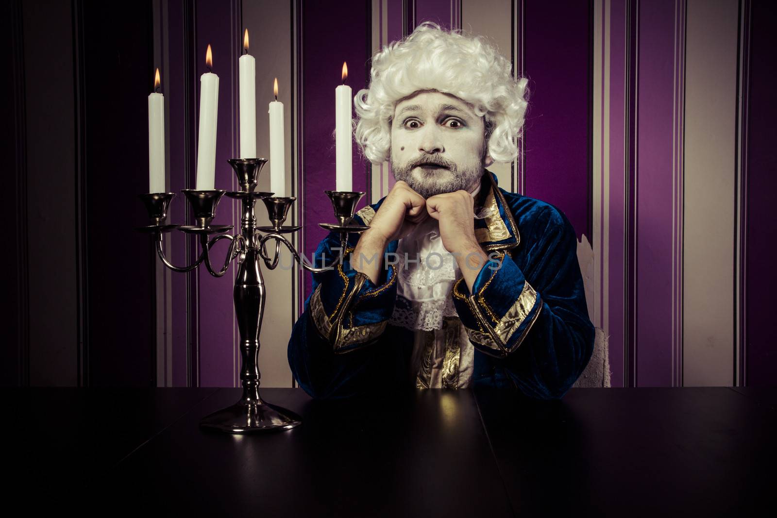 Vintage, man dressed in rococo style, concept of wealth and pove by FernandoCortes