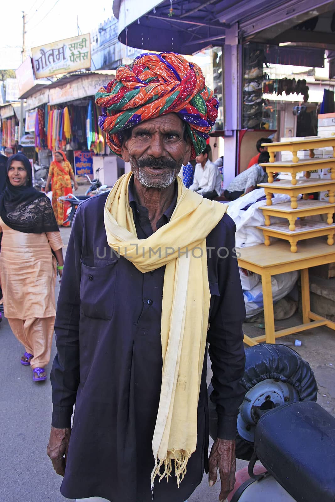 Indian man walking in the streets of old town, Bundi, India by donya_nedomam