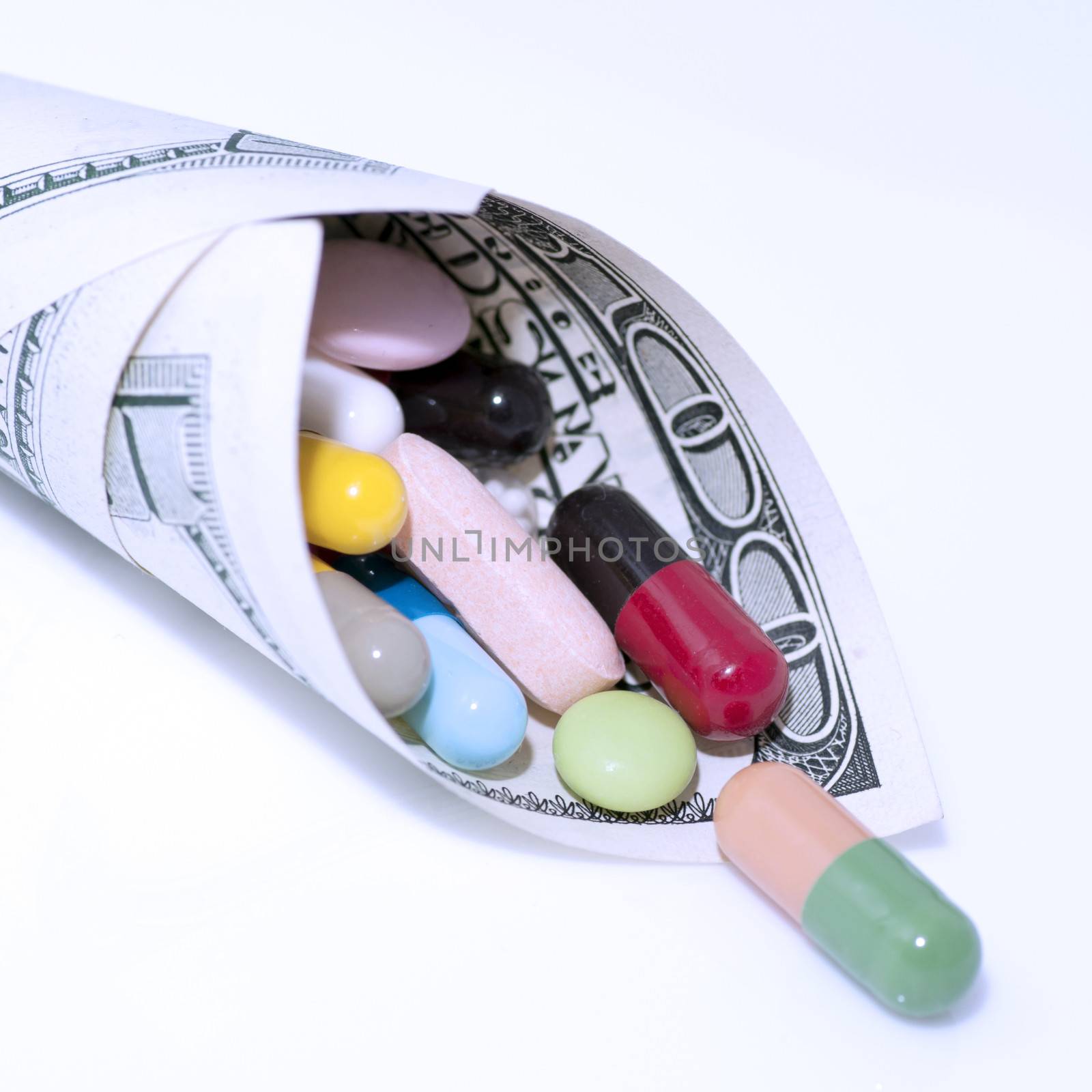 Various drugs in cone made of money