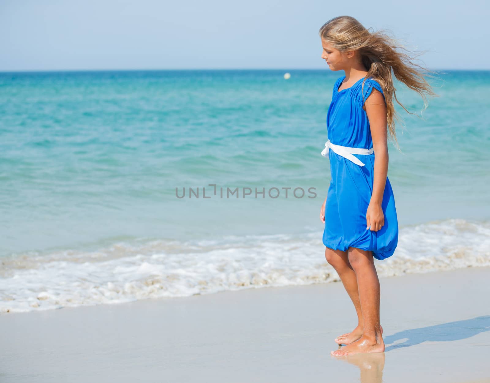 Beautiful happy smiling girl on beach vacation