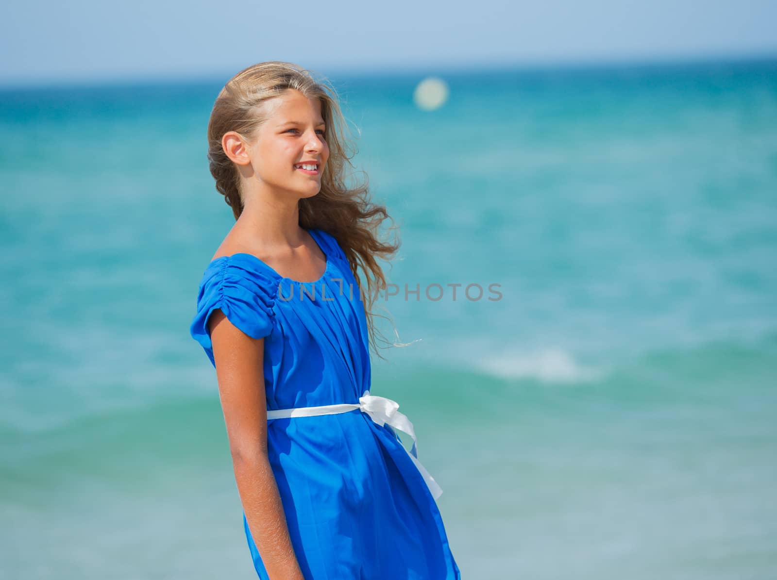 Beautiful happy smiling girl on beach vacation