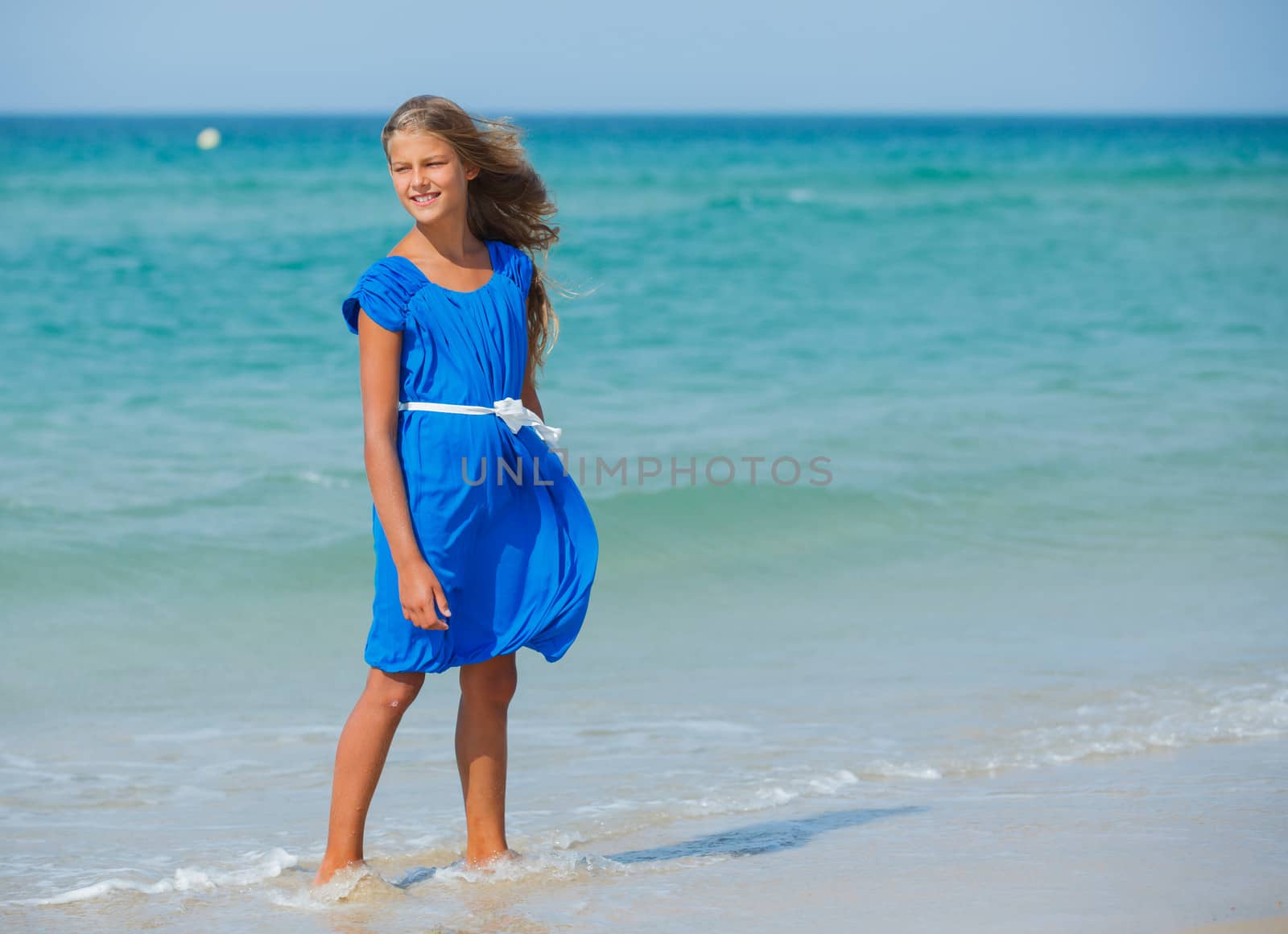 Beautiful happy smiling girl on beach vacation