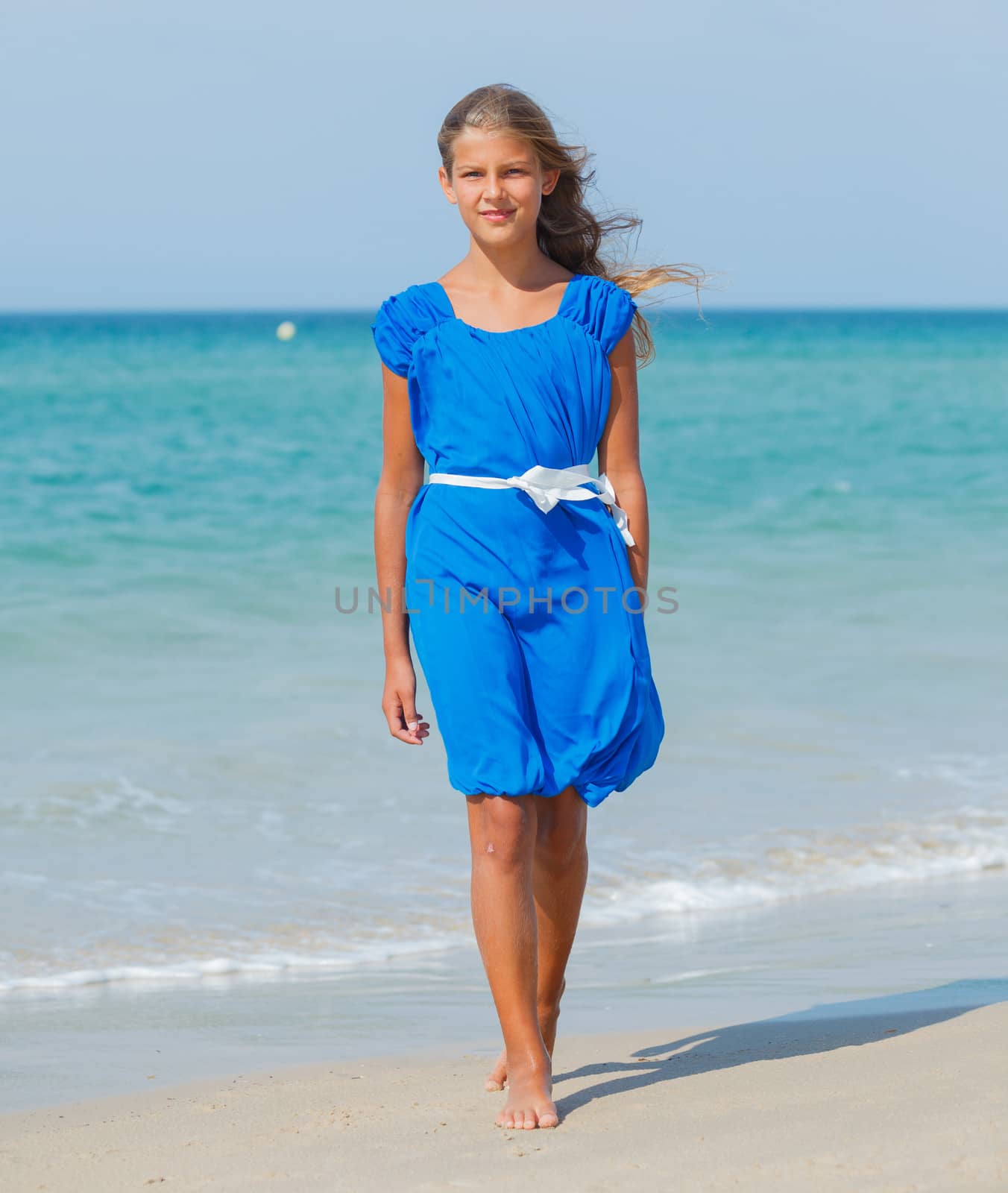 Beautiful happy smiling girl on beach vacation