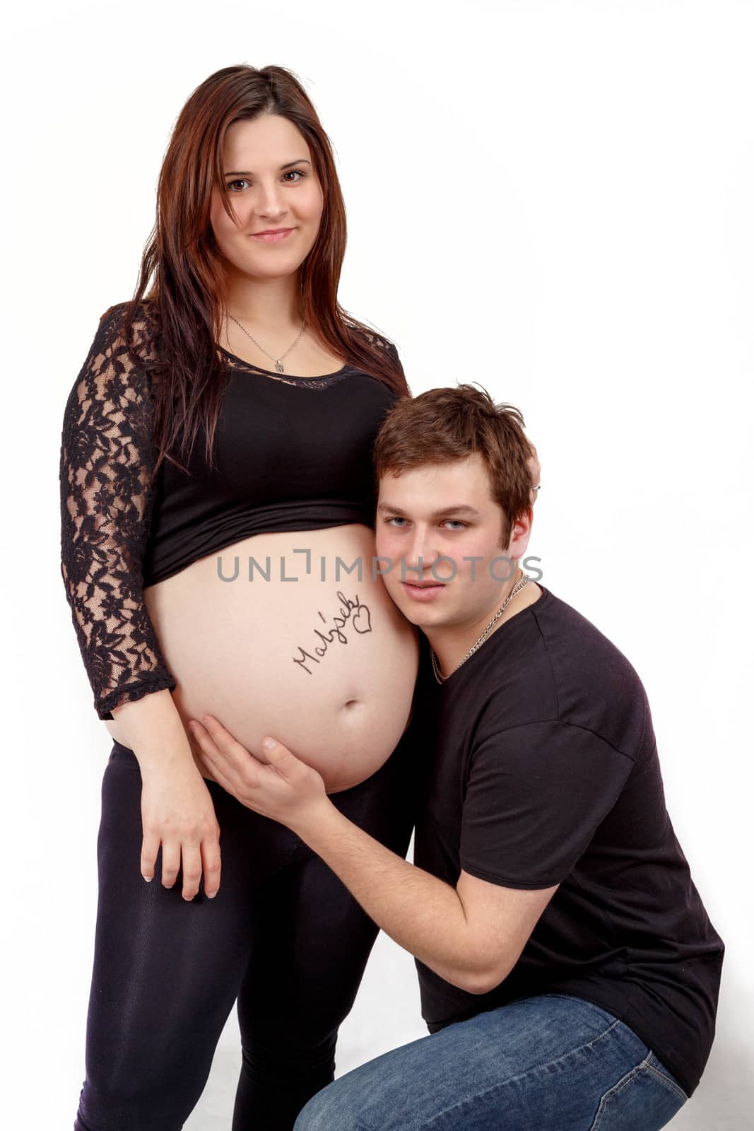 loving happy couple, smiling pregnant woman with her husband, isolated on white background