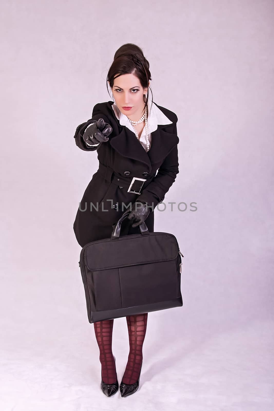 Beautiful businesswoman with briefcase by dukibu