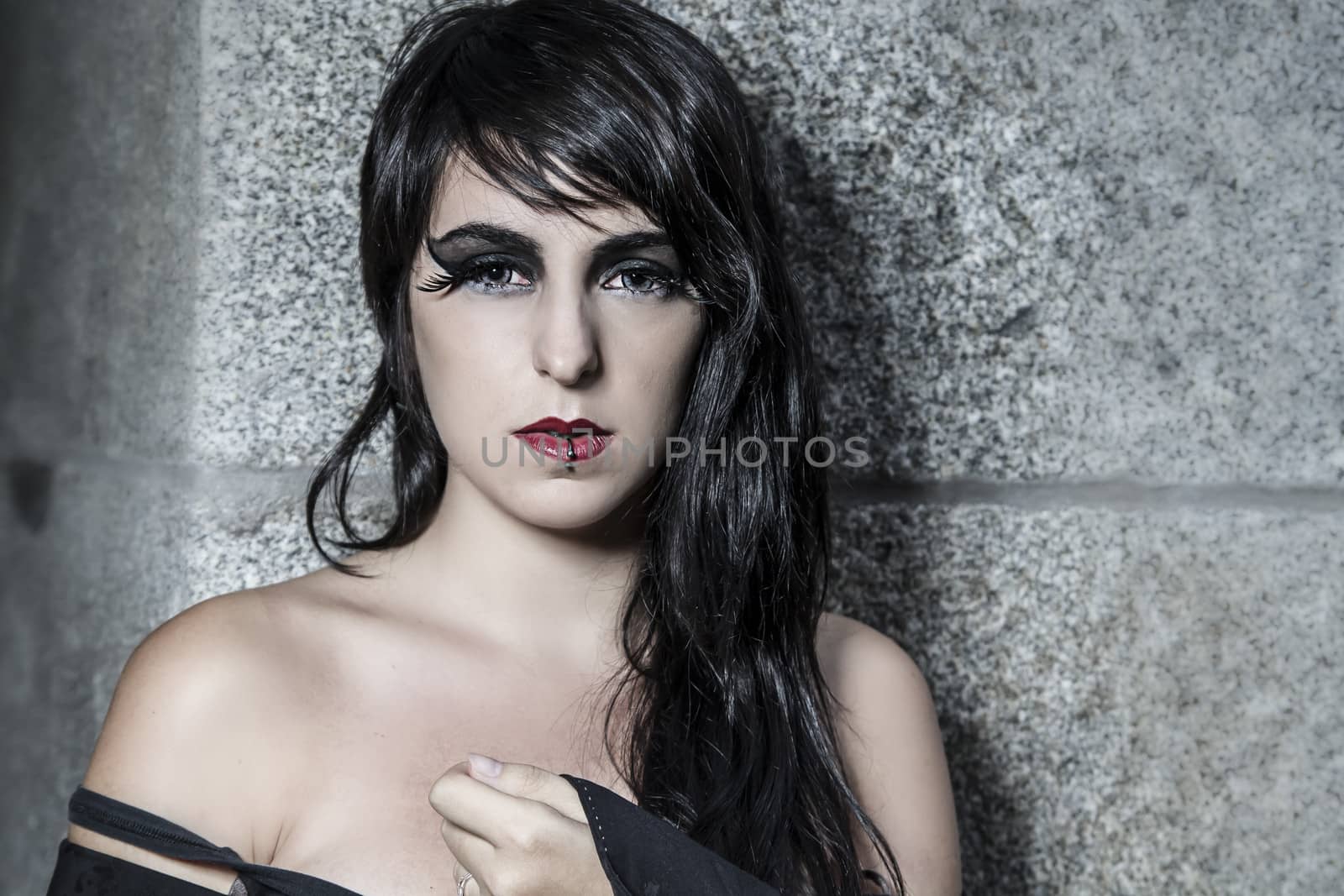 Night, pretty young woman under autumn rain