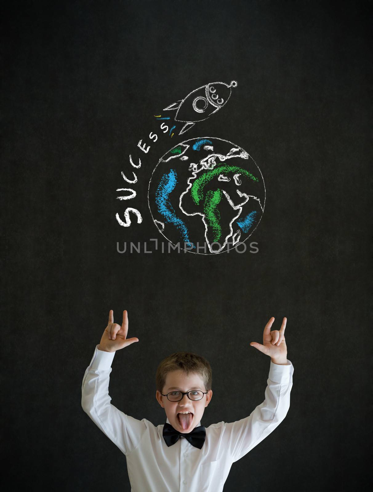 Knowledge rocks boy dressed up as business man with chalk globe and jet world travel on blackboard background