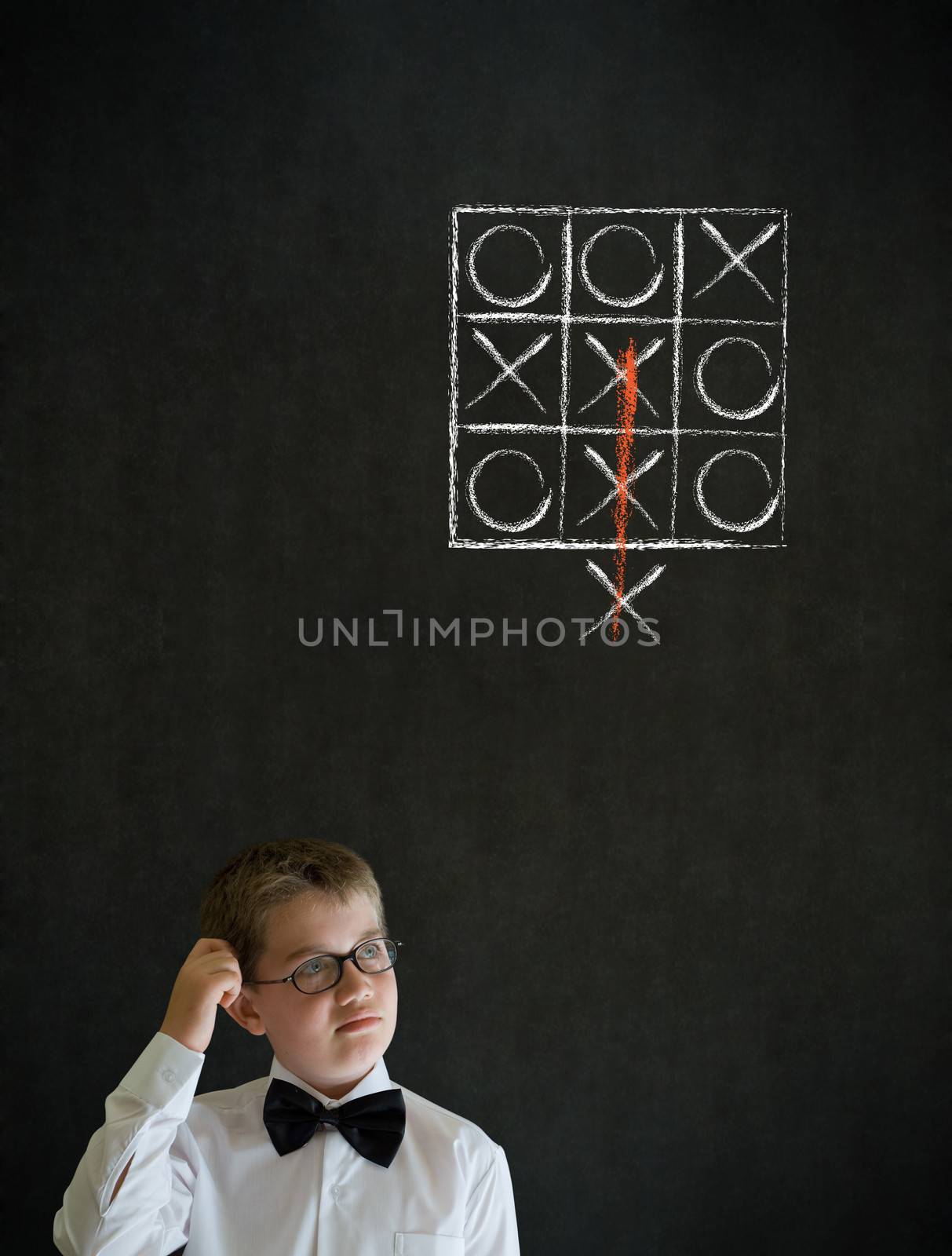 Scratching head thinking boy business man with thinking out of the box tic tac toe concept by alistaircotton