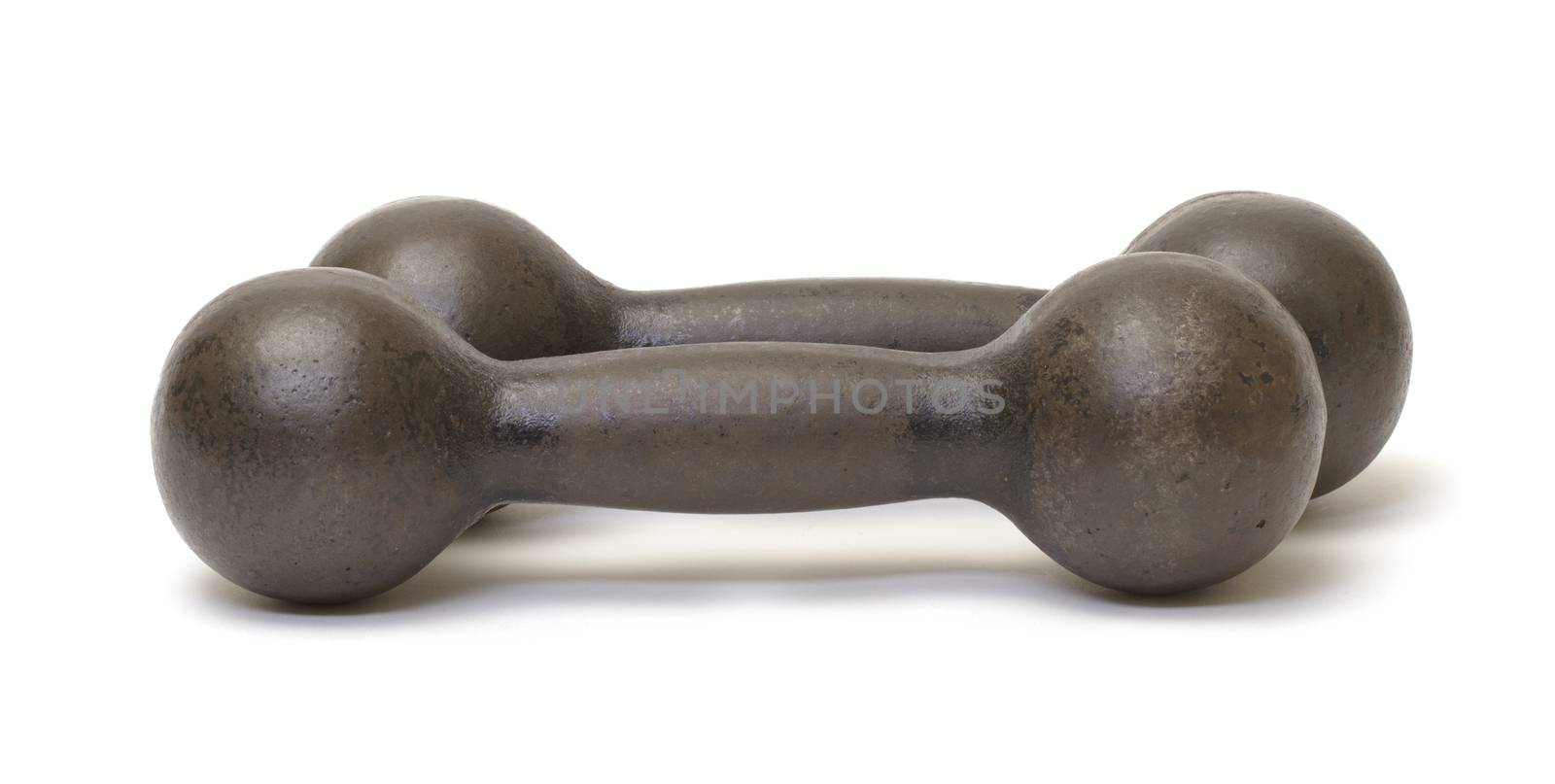 Old rusty iron dumbbells on white background