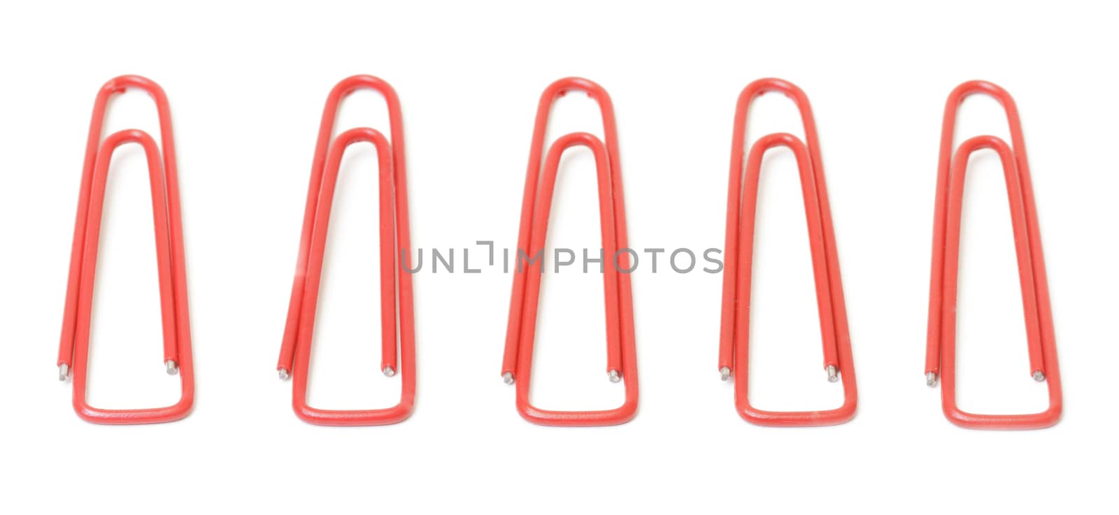 Red paper clips closeup by marslander