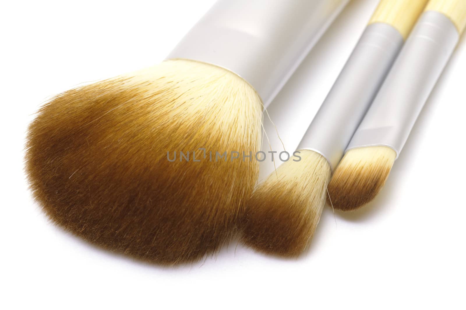 Makeup brushes on white background