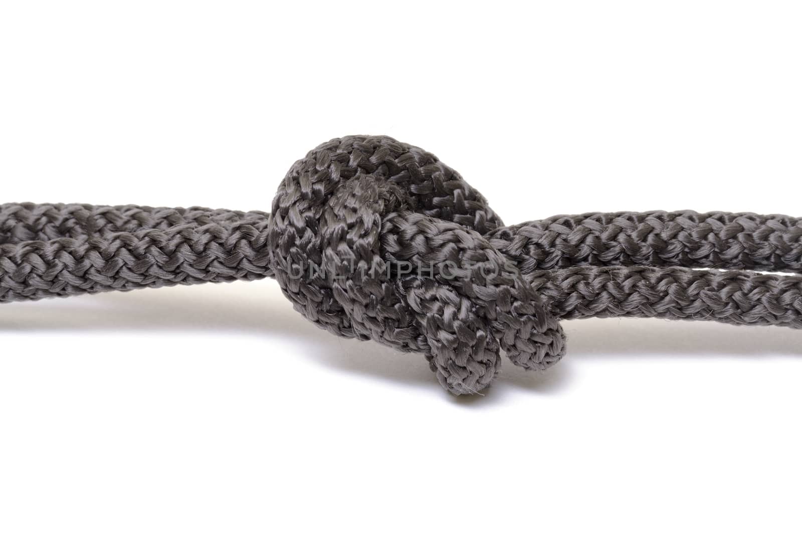 Black rope knot on white background