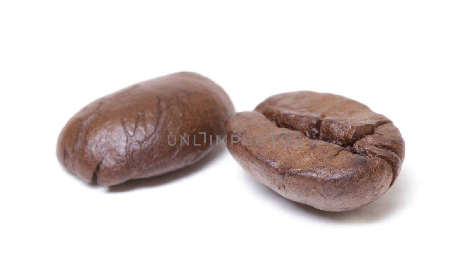 Coffee beans closeup, isolated on white background