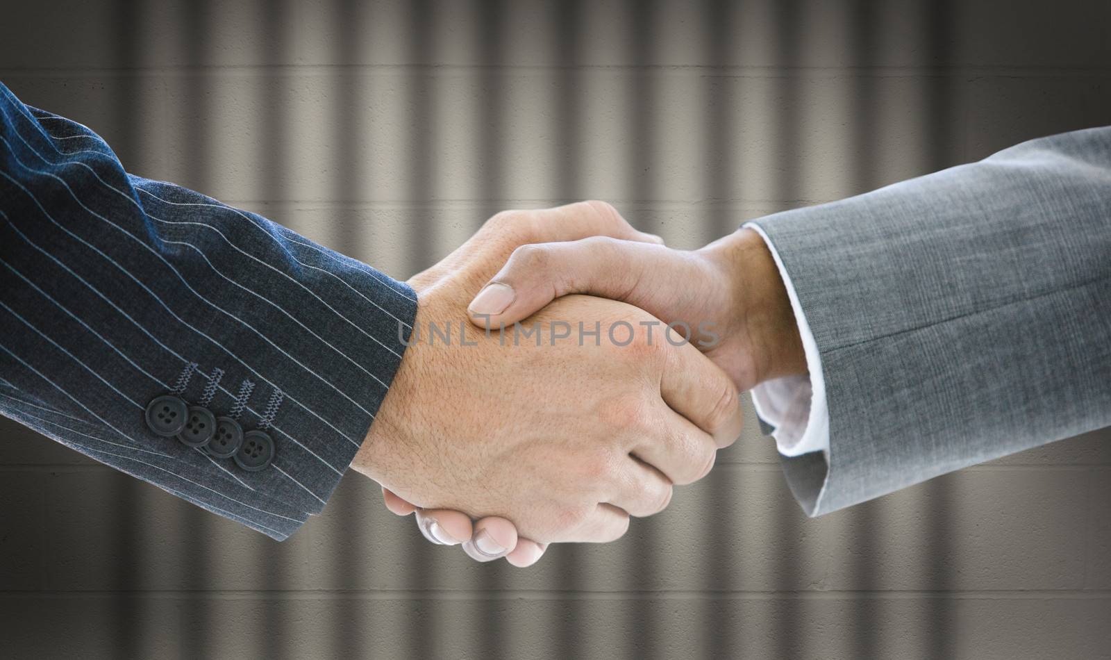 Close up of business people handshaking