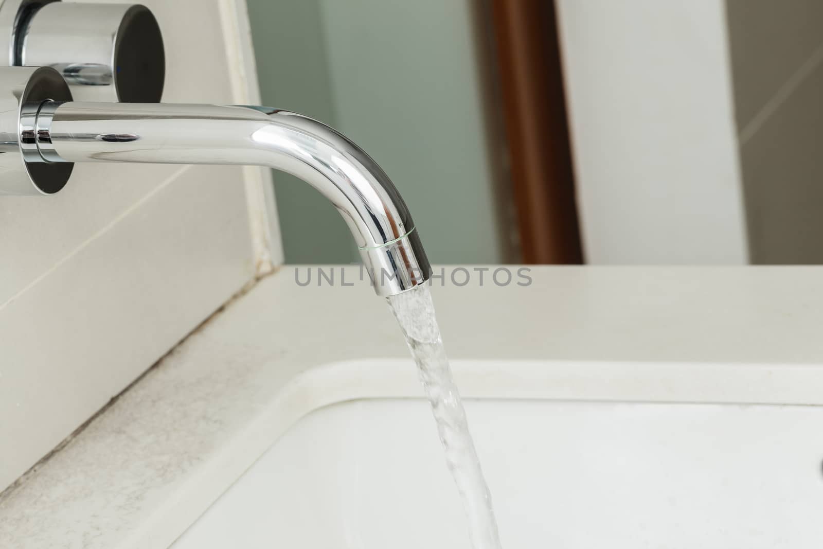 Water tap with flowing water