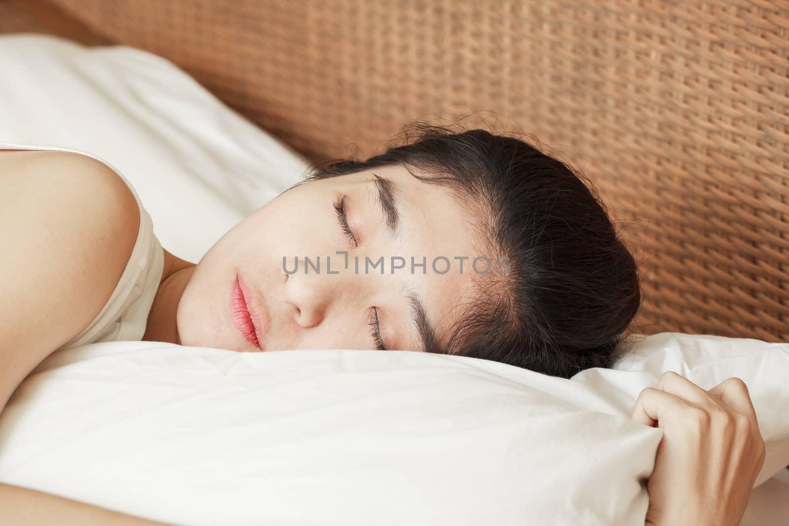 young beautiful woman sleeping in bed by FrameAngel