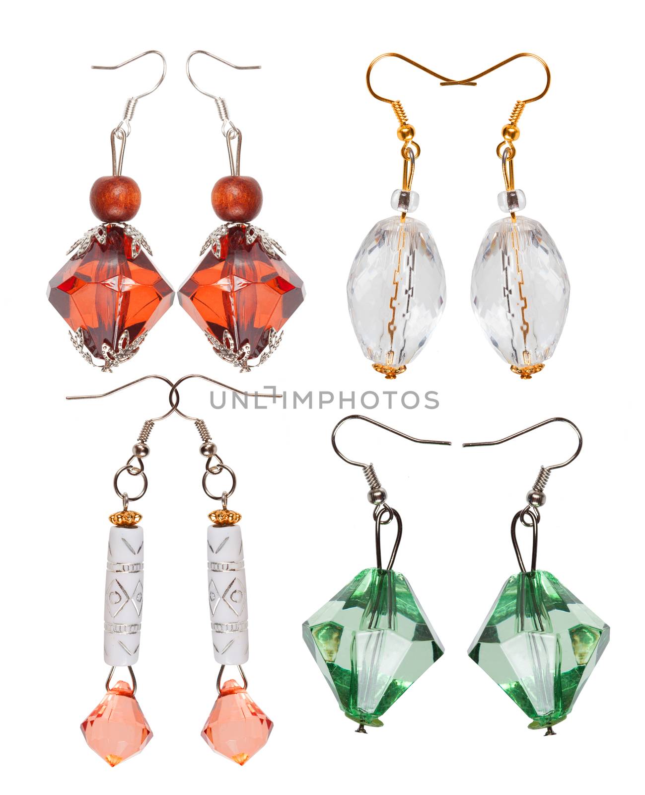 Earrings made of plastic and glass   isolated on white background. Four pairs. Collage.