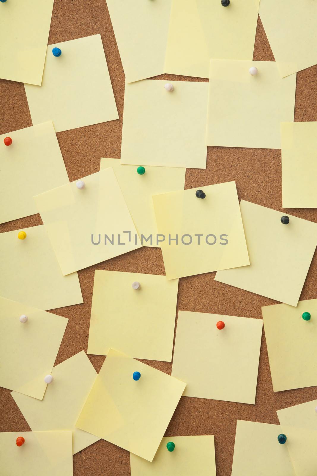 Corkboard and blank paper notes. Close up