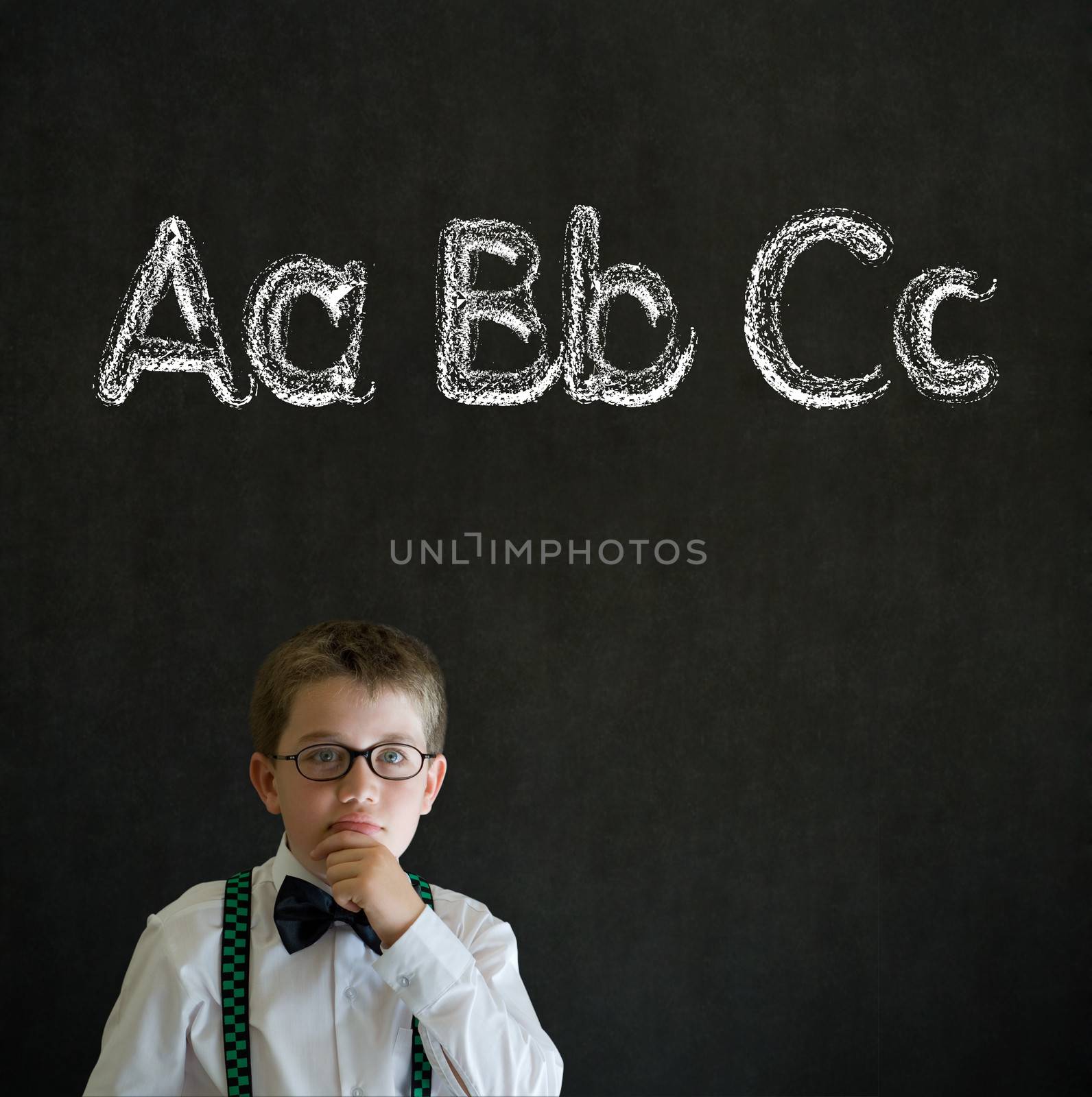 Thinking boy business man with learn English language alphabet by alistaircotton