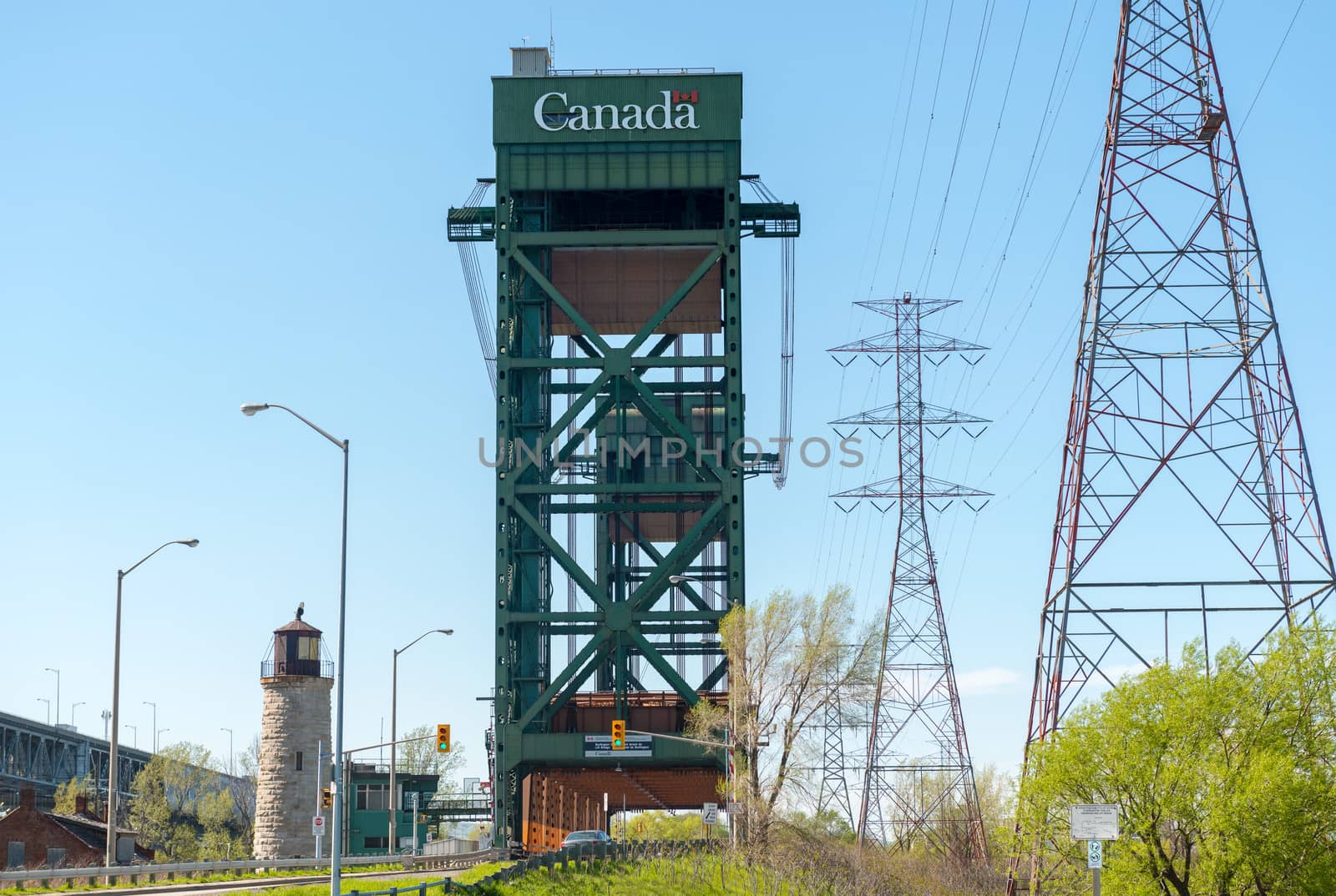 The Burlington Canal Lift Bridge is located on the western shore of Lake Ontario. The bridge spans the Burlington Canal that was opened in 1826. The bridge structure is a tower driven, vertical lift and moveable bridge. The lift span is 116 metres long, weighs 1,996 tonnes and has a vertical lift of 33.5 metres.