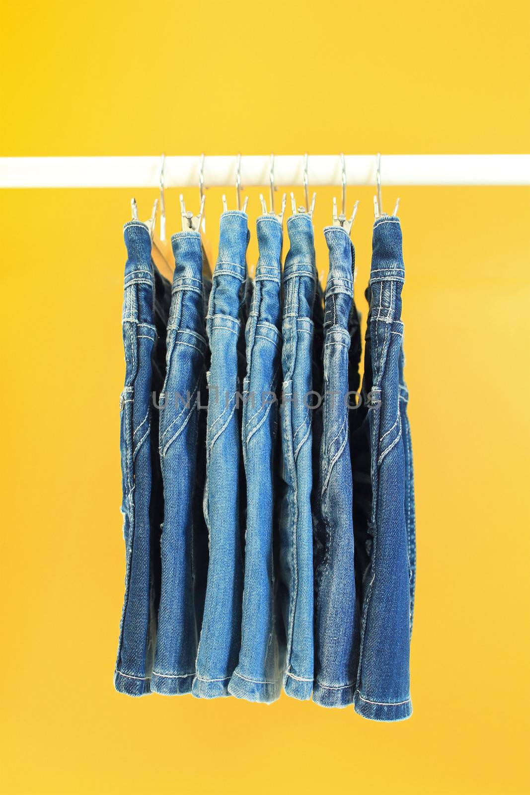 Row of hanged blue jeans