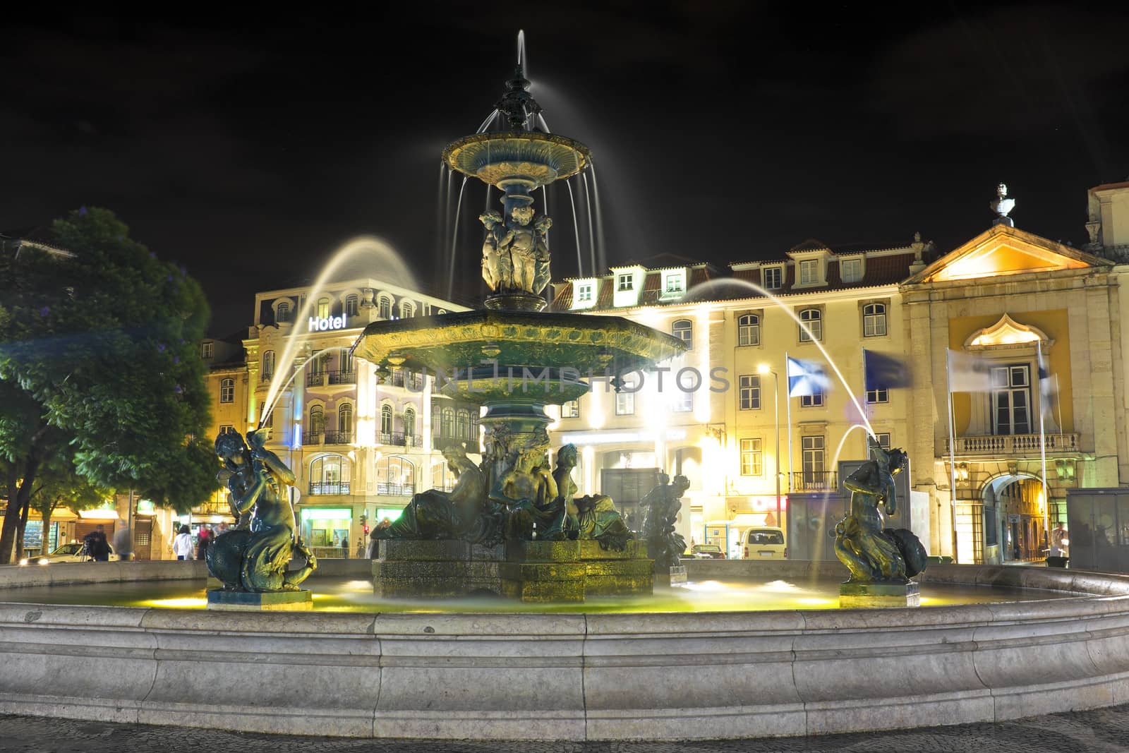 Night-lit fountain in Rossio Square, Lisbon, Portugal