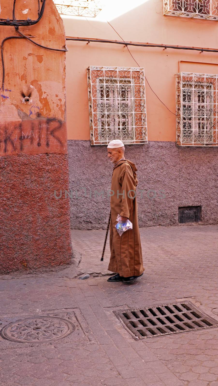 FES, MAROCCO - October 22, 2013 : Man beautifully dressed up on Eid al-Adha. The festival is celebrated by sacrificing a sheep and distributing the meat to relatives, friends, and the poor.