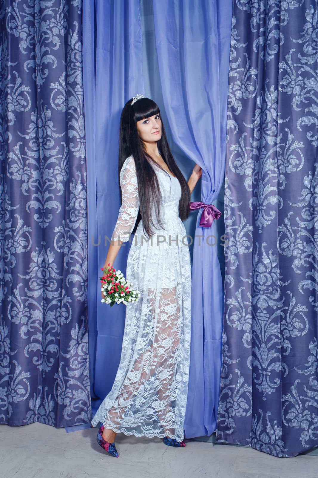 Attractive young girl with gorgeous bouquet of flowers shot in studio