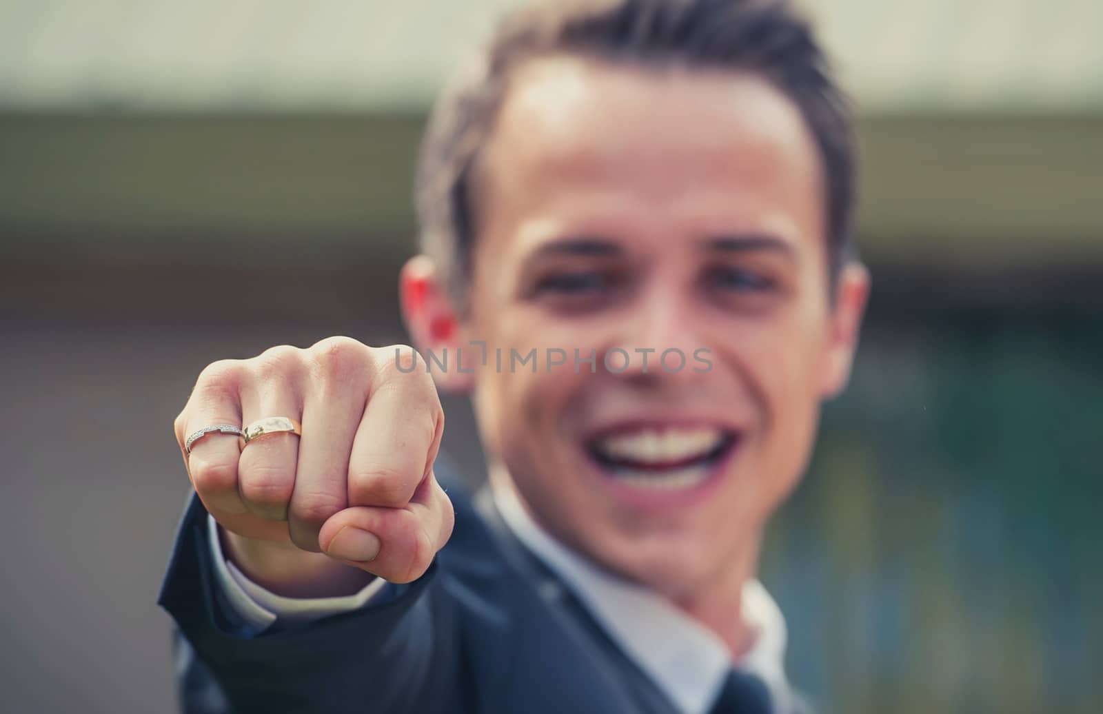 Happy Groom showing Wedding Ring by ocusfocus