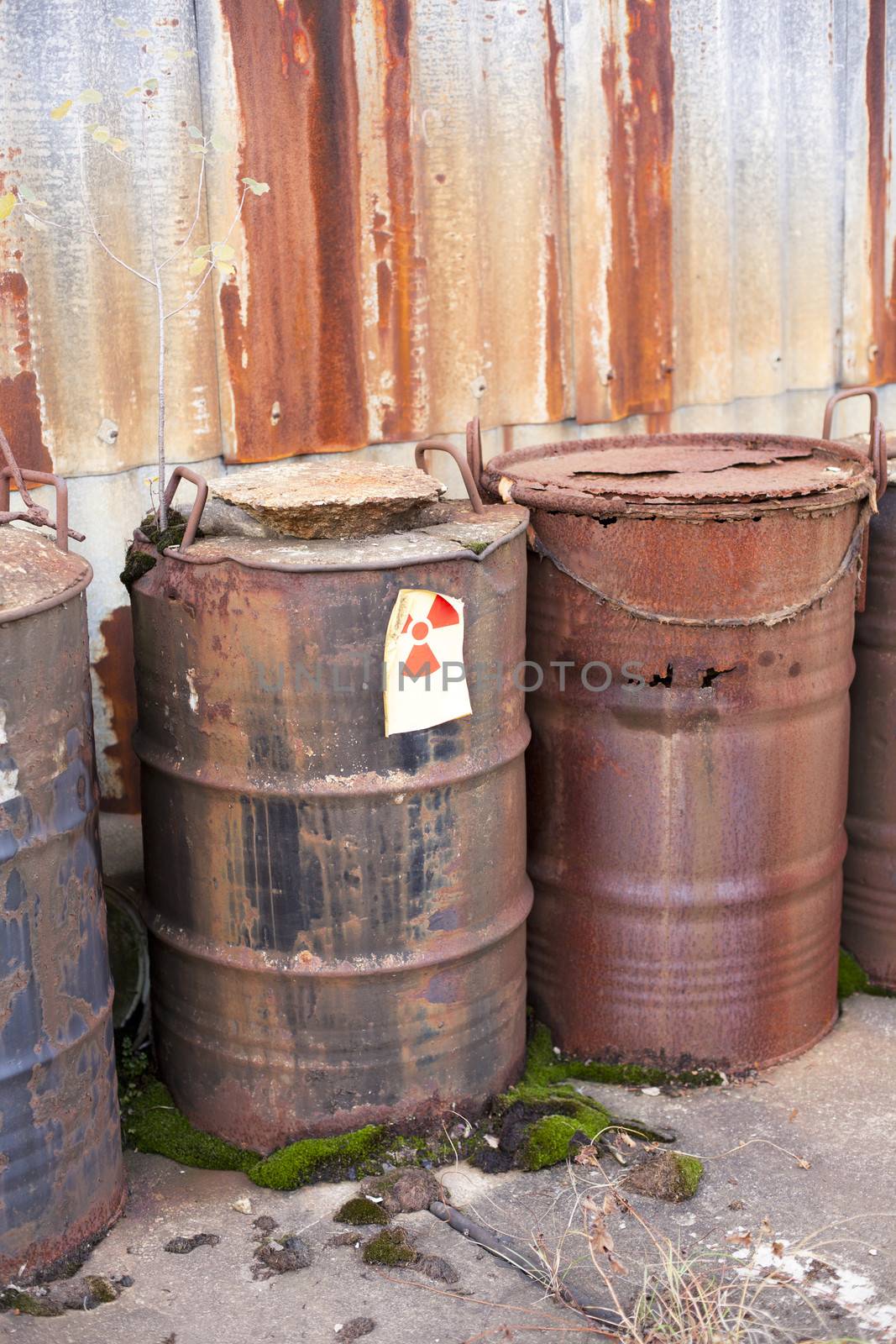 Rusty barrels with radioactive waste disposal