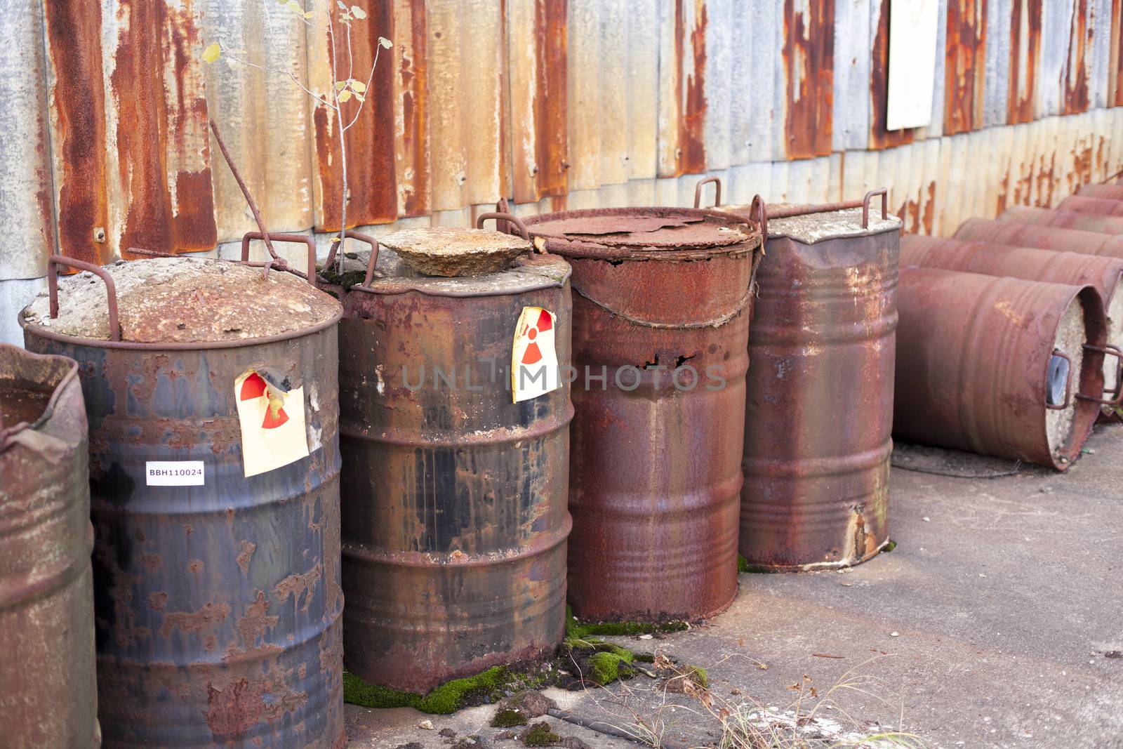 Rusty barrels with radioactive waste disposal