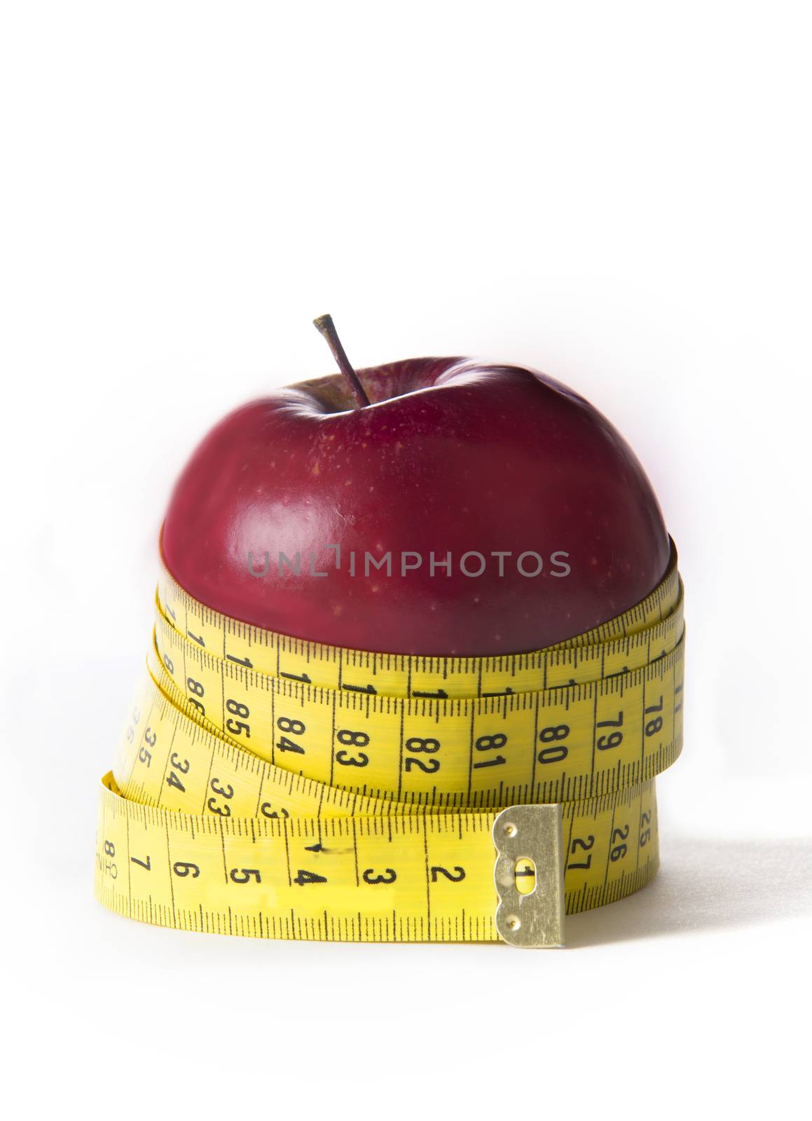 Apple wrapped in tailor tape in concept of Diet and Health